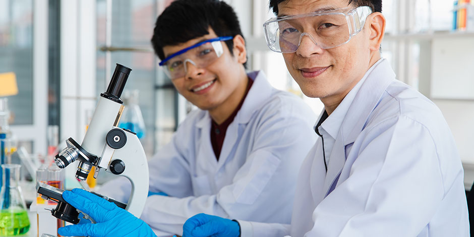 scientist wearing lab coat and protective eyewear